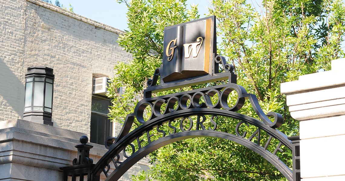 GW symbol on a campus gate overlooking campus