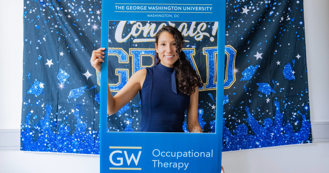 Carolin Capurro Perez with GW OTD Sign