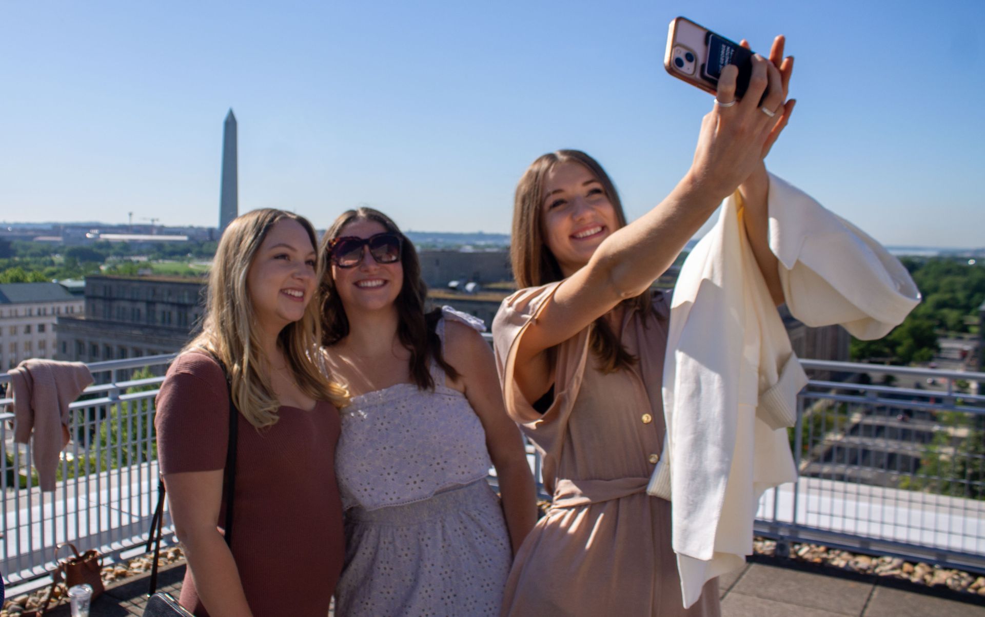 Three GW OT students taking a selfie on balcony