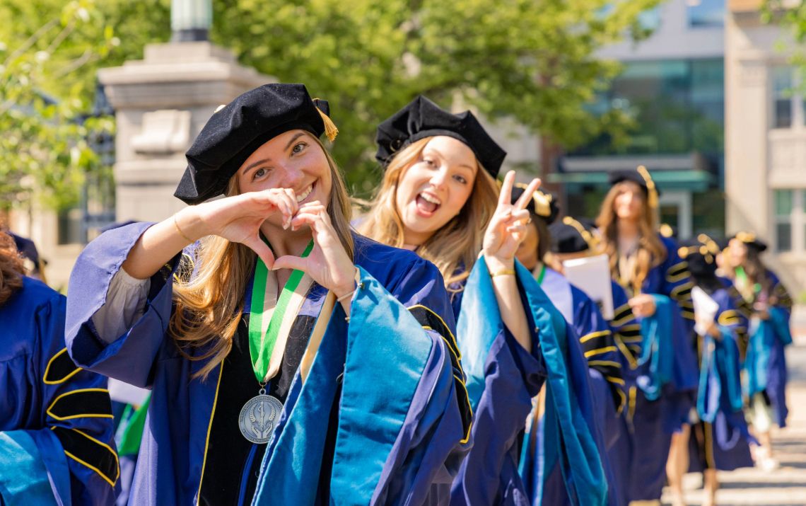 Molly Dougherty and Amy Eybers in line for graduation
